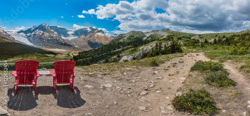 Panorama Pair of Red Chairs on the Trail Up to Wilcox Pass © kellyvandellen
