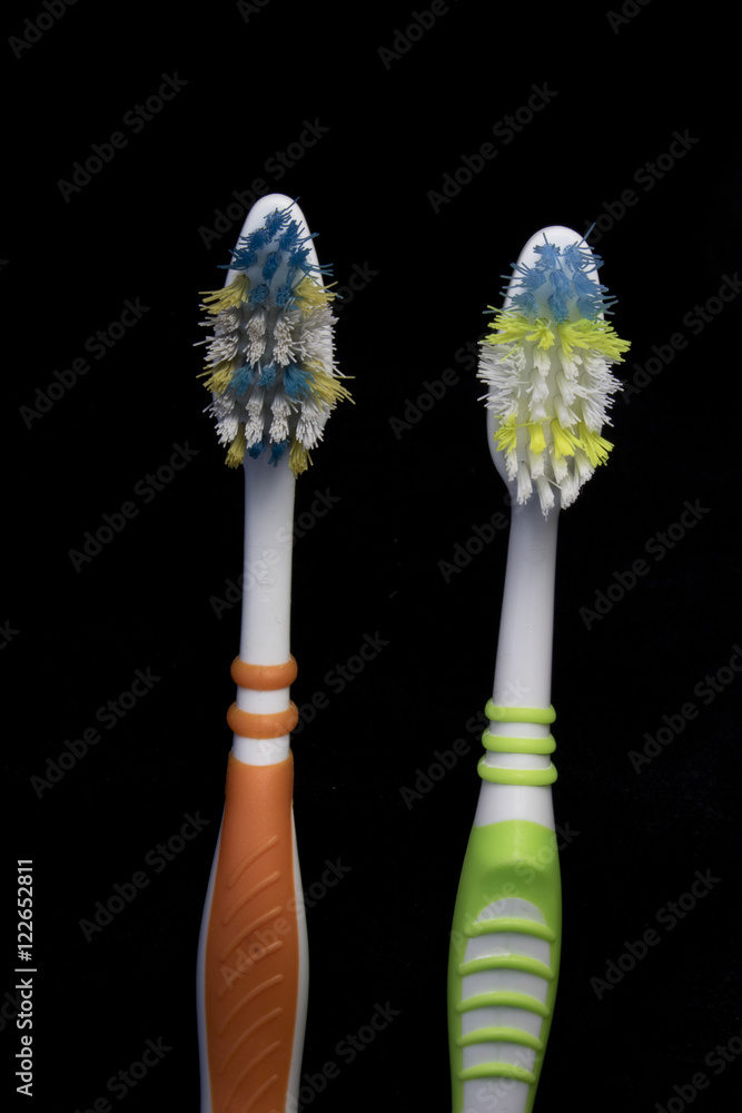 Used Toothbrush on Black Background Used Toothbrush on Black Background