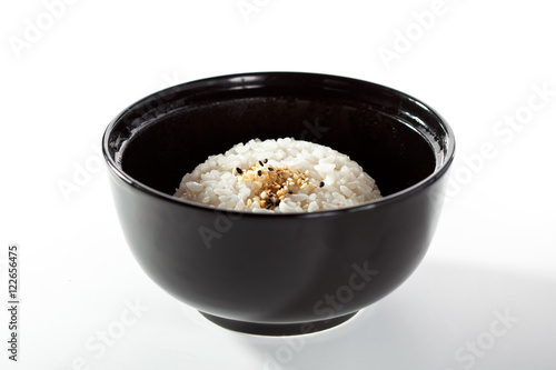 Black Bowl of Cooked Rice over White