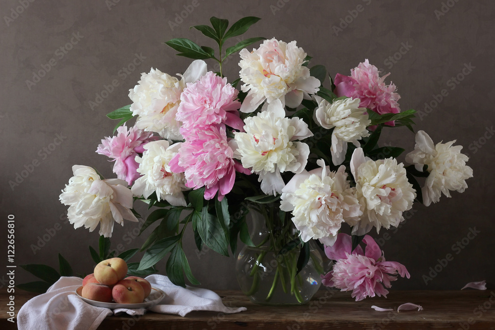 Still-life with a bouquet of peonies and peaches. Still-life with a bouquet of peonies and peaches.