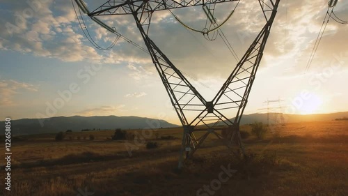Electricity pylons at sunset / Aerial videos