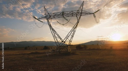 Electricity pylons at sunset / Aerial videos