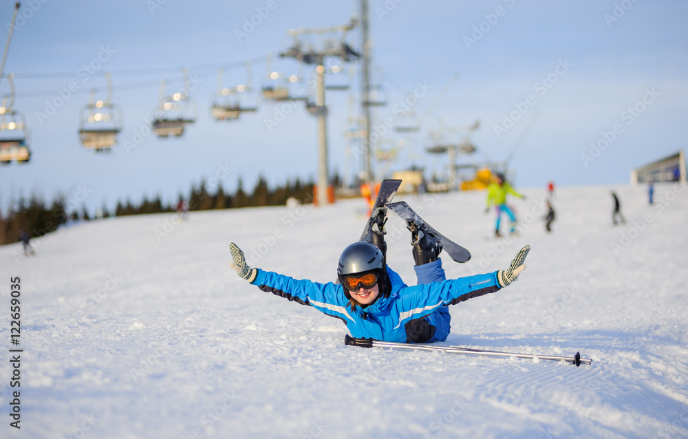 beautiful female skier in blue ski suit 
