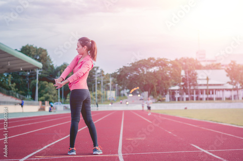 Beautiful woman fitness sunrise jogging workout wellness concept. © EsanIndyStudios