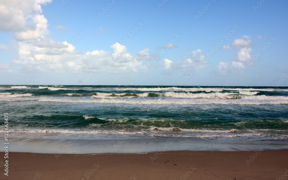 The Blue and Green Ocean Waves At The Jupiter Beach Sea Shore