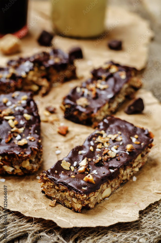 Coconut Granola Bars with chocolate glaze and nuts
