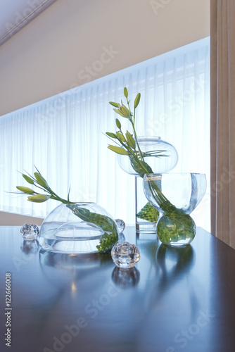 Glass vases with lilies 