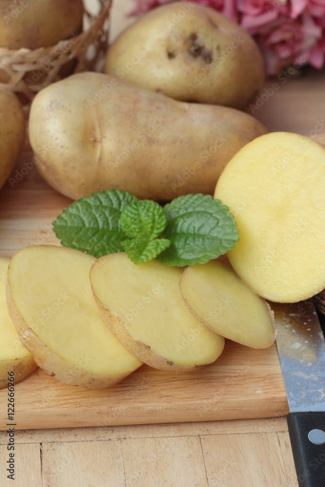 Potatoes raw vegetables with slices for cooking. Potatoes raw vegetables with slices for cooking.