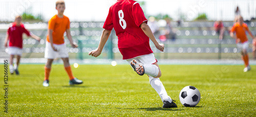 Fototapeta Naklejka Na Ścianę i Meble -  Children Playing Professional Football Match