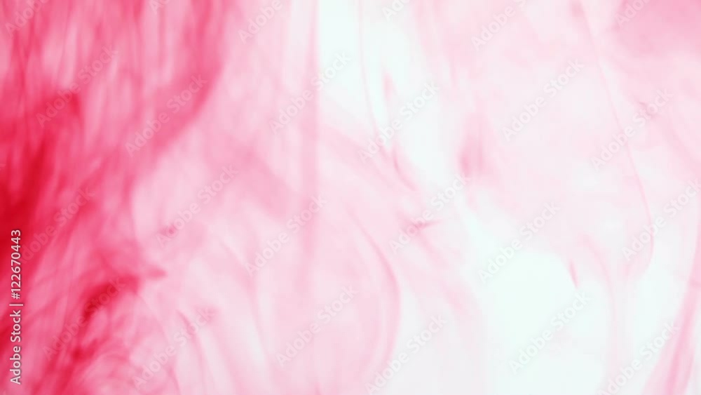 red paint poured in water red paint poured in water