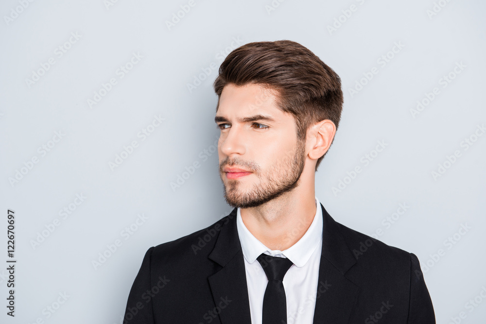 Portrait of handsome bearded man wearing black suit Portrait of handsome bearded man wearing black suit