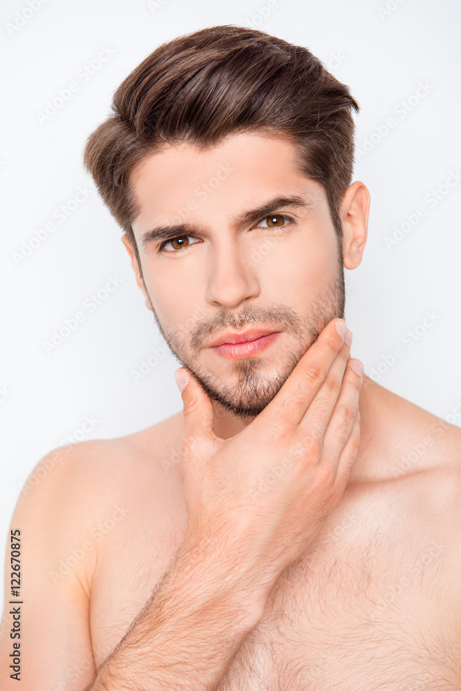 Portrait of handsome bearded man touching face and going to shav Portrait of handsome bearded man touching face and going to shav
