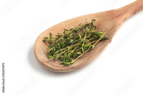 Fresh Thyme into a spoon