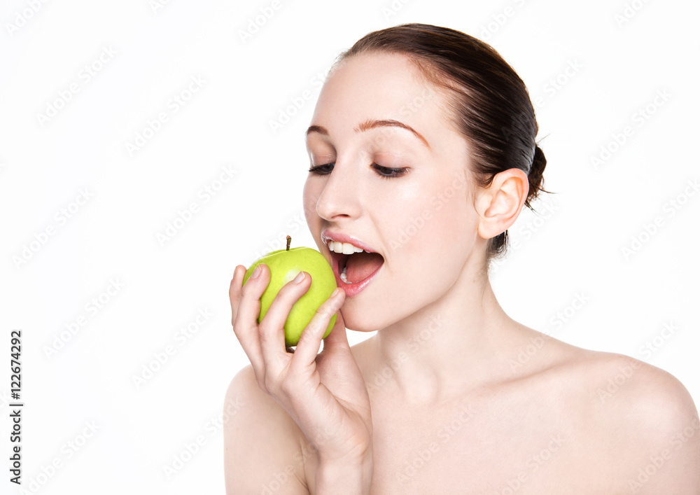 Beautiful fitness woman eating healthy apple Beautiful fitness woman eating healthy apple