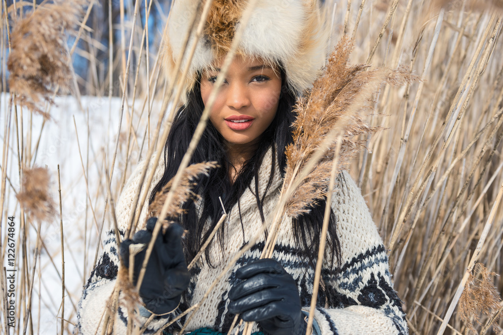 Portrait of one young woman in a meadow in winter Portrait of one young woman in a meadow in winter