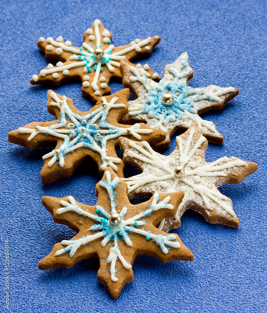 Gingerbread shaped snowflakes decorated with icing Gingerbread shaped snowflakes decorated with icing