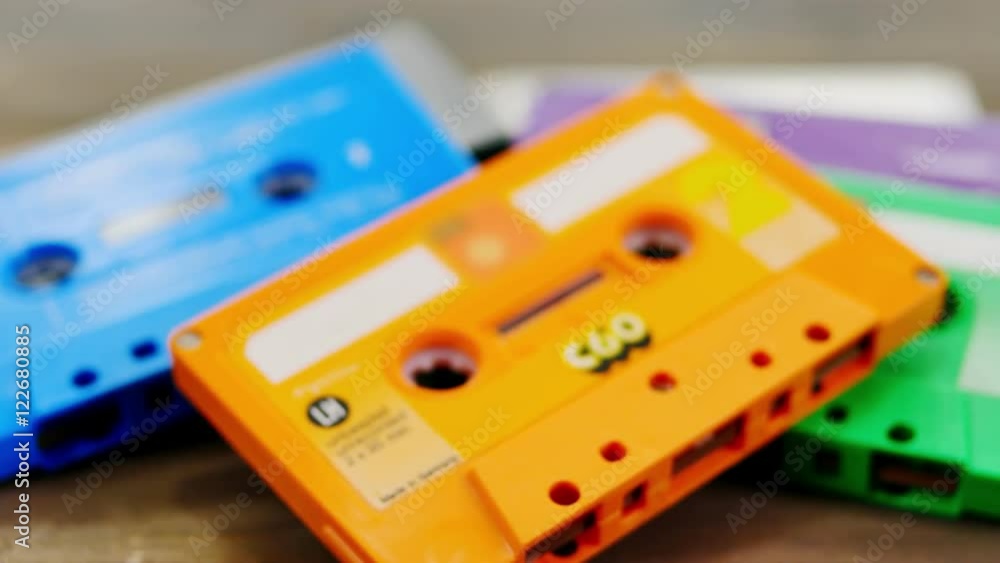 music cassettes on wooden table dolly motion music cassettes on wooden table dolly motion