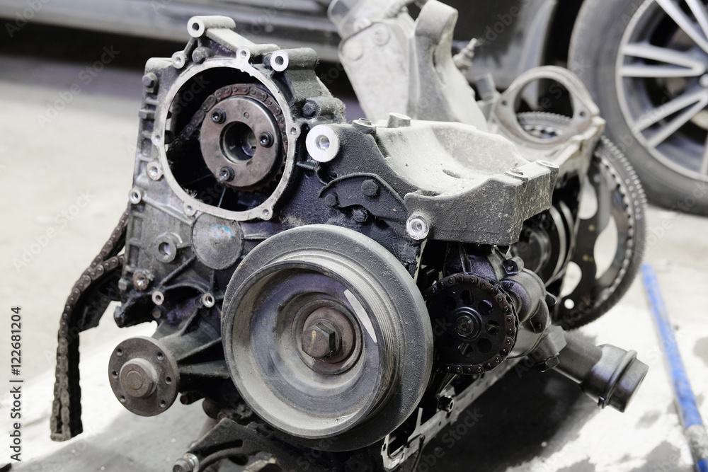 The image of an unassembled transmission in repair station The image of an unassembled transmission in repair station