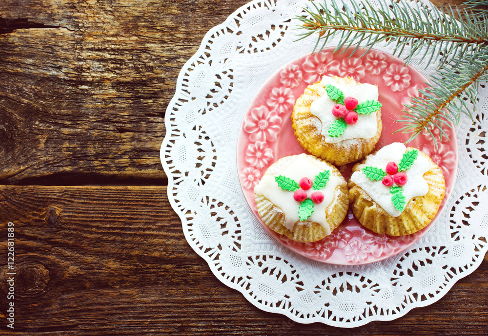 Beautiful Christmas cupcakes on old wooden background Beautiful Christmas cupcakes on old wooden background