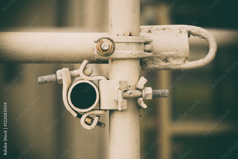 metal pipes, yellow background, the white tube metal pipes, yellow background, the white tube