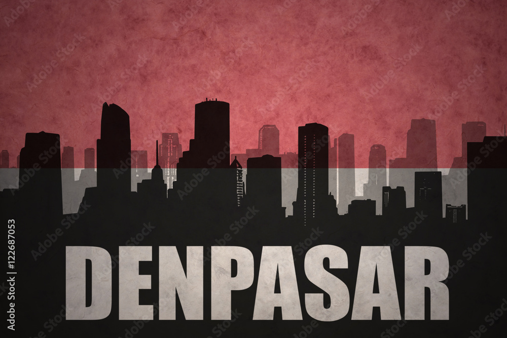 abstract silhouette of the city with text Denpasar at the vintage indonesian flag background
