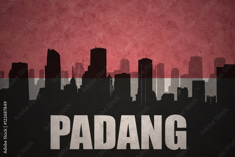abstract silhouette of the city with text Padang at the vintage indonesian flag background