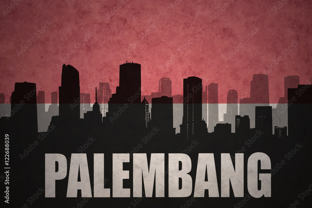 abstract silhouette of the city with text Palembang at the vintage indonesian flag background