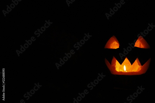 scary ghost face glowing on Halloween