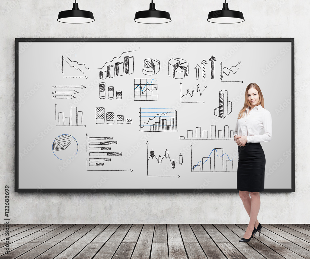 Smiling blond businesswoman with various graphs Smiling blond businesswoman with various graphs