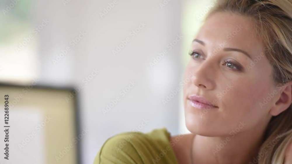 Portrait of beautiful blond woman in office