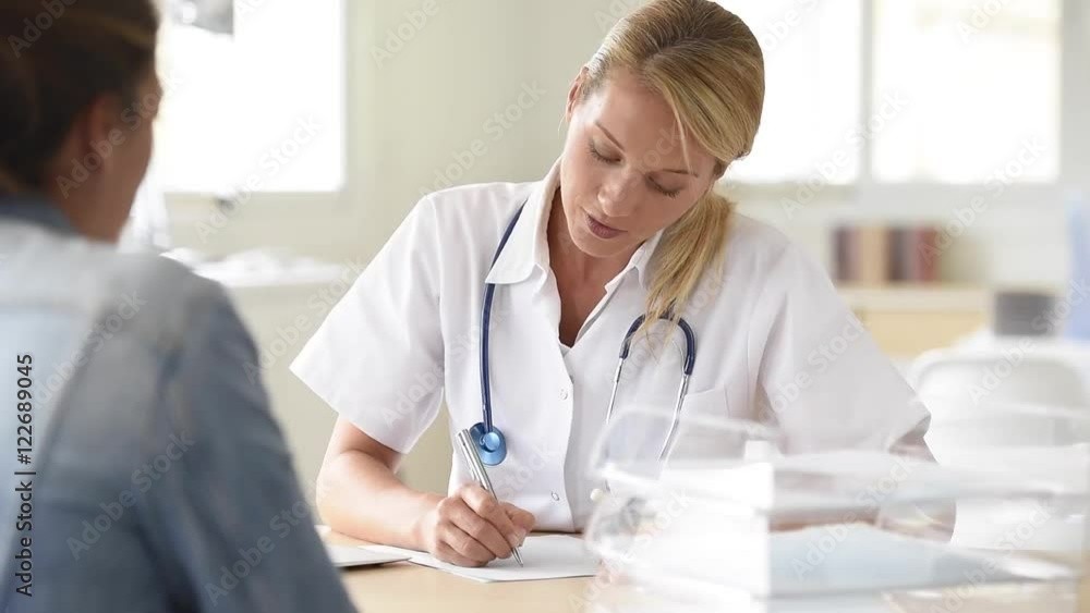 Portrait of doctor giving prescription to patient Portrait of doctor giving prescription to patient