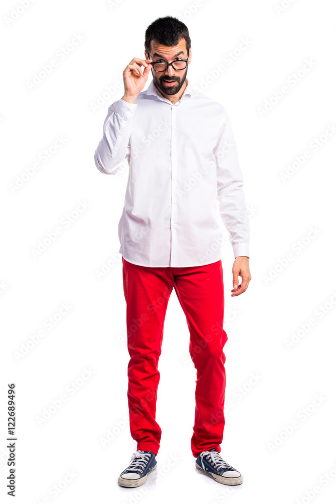 Handsome man with glasses showing something Handsome man with glasses showing something