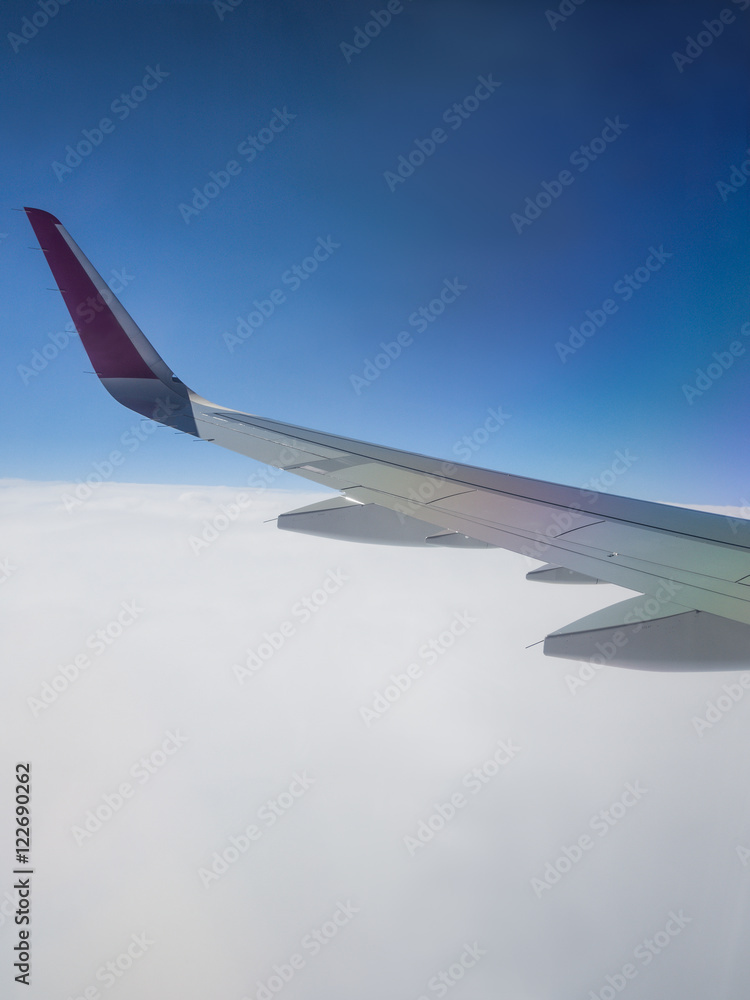 Wing from Aircraft above the clouds Wing from Aircraft above the clouds