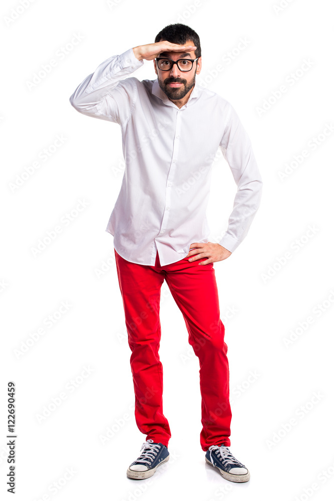Handsome man with glasses showing something Handsome man with glasses showing something