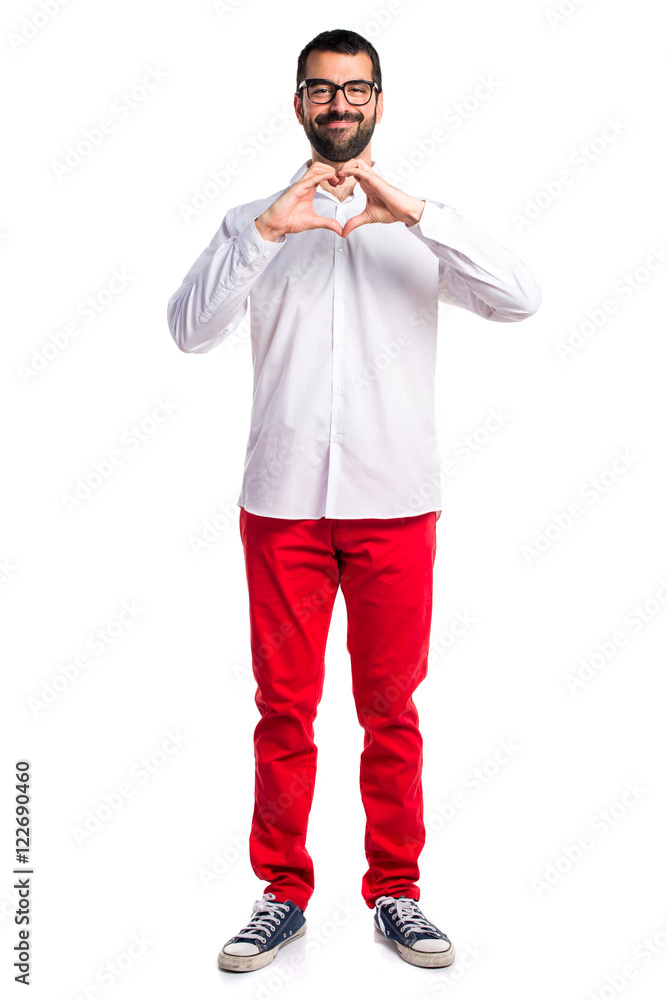 Handsome man with glasses making a heart with his hands Handsome man with glasses making a heart with his hands
