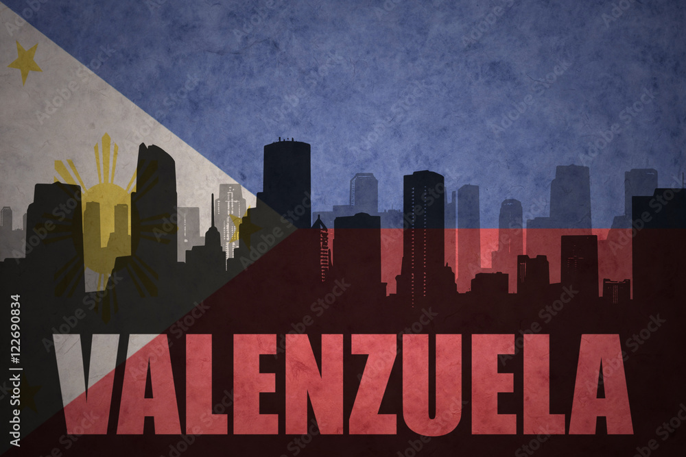 abstract silhouette of the city with text Valenzuela at the vintage philippines flag background