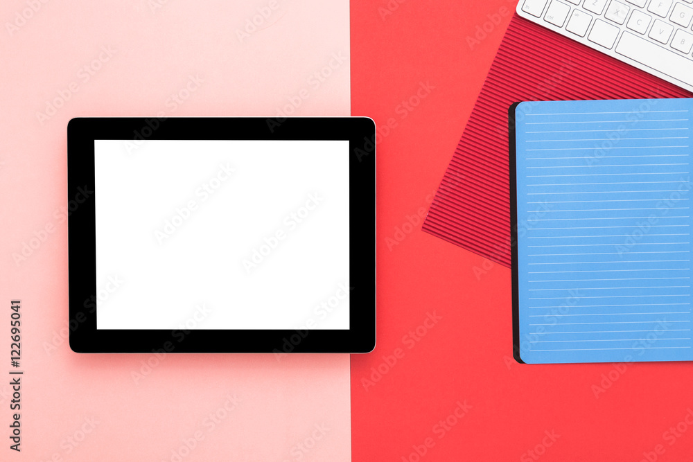 Red table with blank tablet and school supplies. Office desk Red table with blank tablet and school supplies. Office desk