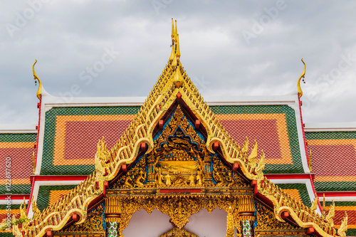 Thai art on roof Church at phathat Cheung choom woravihan temple photo