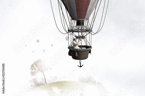 Man traveling in aerostat . Mixed media