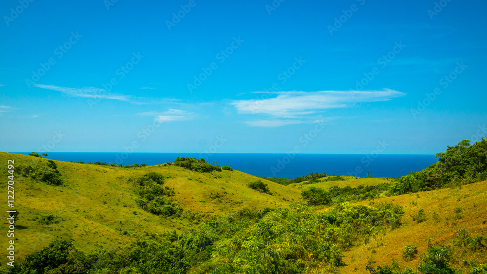 Fototapeta premium Green, Rolling Island Hills - With Blue Ocean View - Catanduanes, Philippines