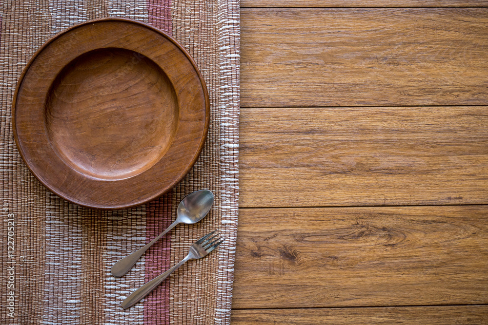 old wooden table with empty plate on a wooden table and copyspac old wooden table with empty plate on a wooden table and copyspac