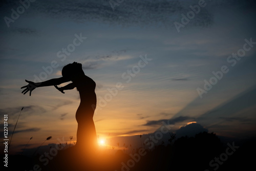 silhouette woman happy and sunset