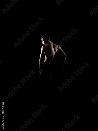 Silhouette trace of a male ballet dancer on black