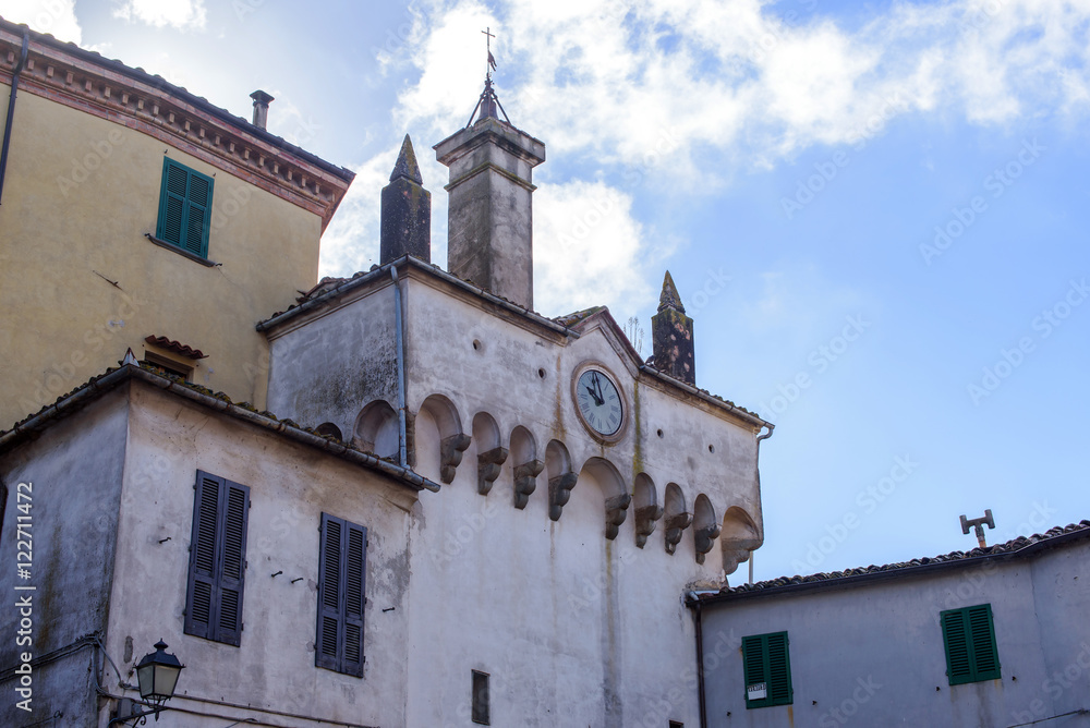building with clock and bell tower, italy