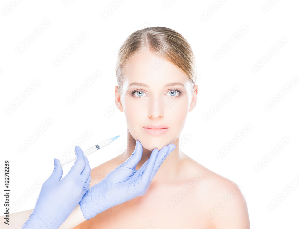 Doctor injecting botox into face of a young woman Doctor injecting botox into face of a young woman