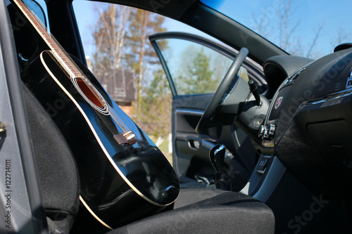 guitar outdoor near car photo