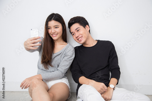 Young asian couple selfie