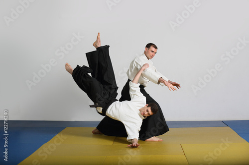The martial art of Aikido. two men demonstrate the techniques of