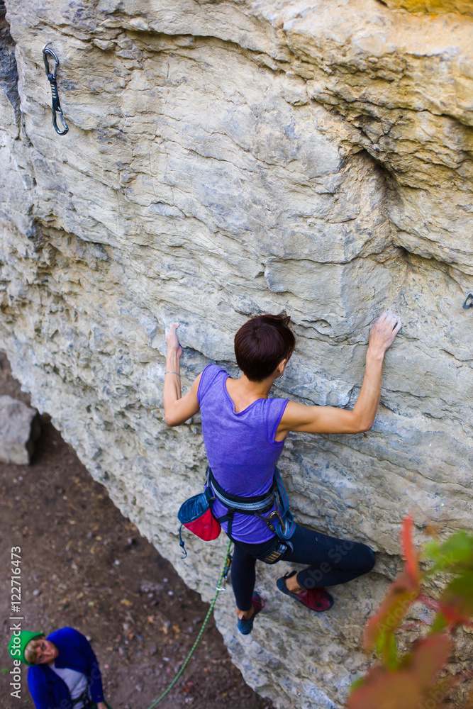 Two friends have been climbing on the rocks. Two friends have been climbing on the rocks.