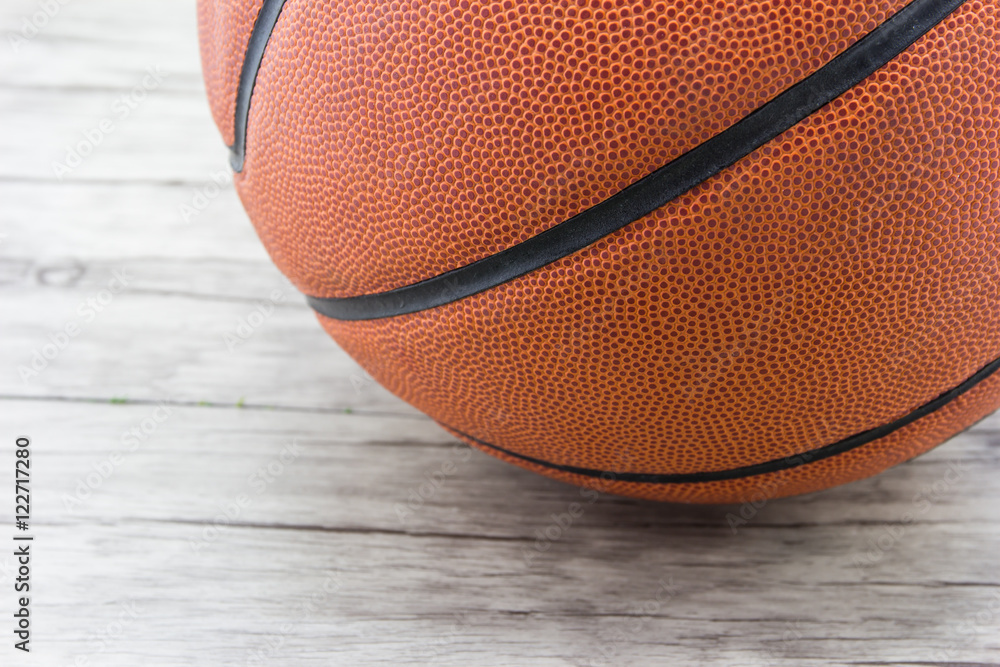Fototapeta premium Basketball ball on wood background